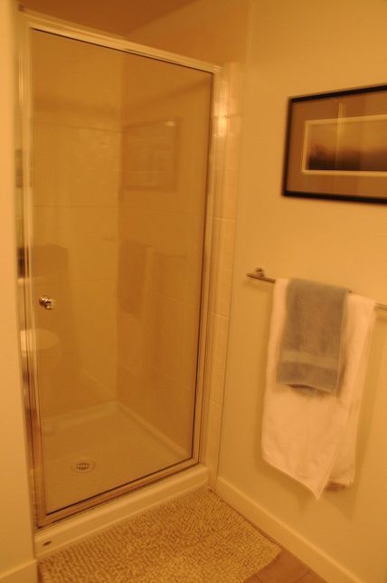 Bright bathroom with glass shower and towel rack. - 705 - 538 Smithe, Vancouver Downtown