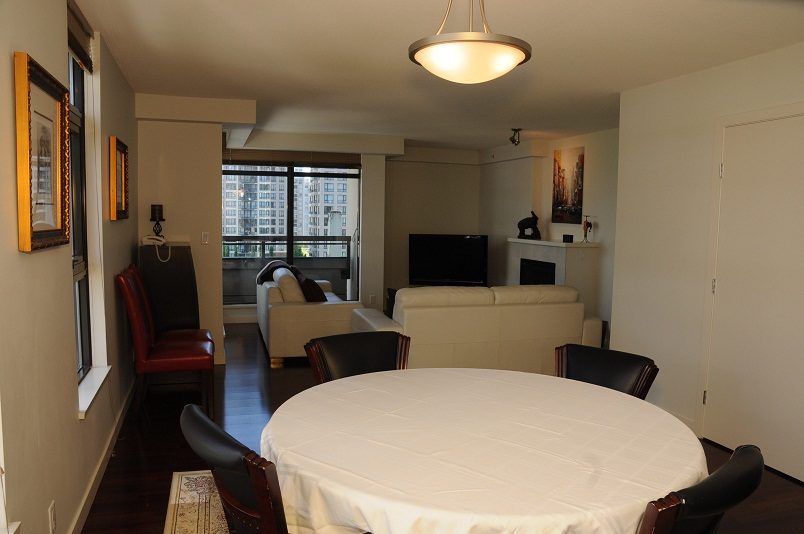 Furnished dining area with city view and hardwood floors. - 705 - 538 Smithe, Vancouver Downtown