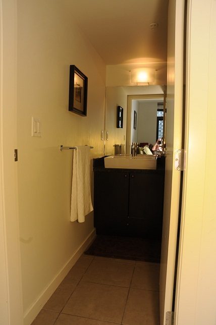 Furnished bathroom with dark cabinets and a towel rack. - 705 - 538 Smithe, Vancouver Downtown