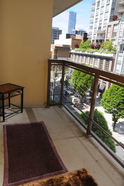 Furnished balcony with city view and outdoor seating. - 705 - 538 Smithe, Vancouver Downtown