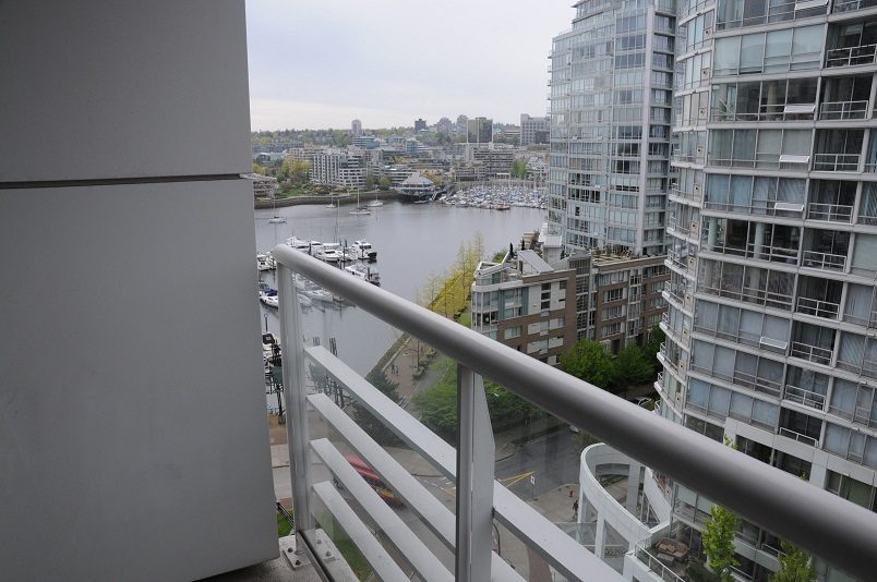 Bright balcony with city view and marina, modern furnishings. - 1607 - 1199 Marinaside Crescent, Vancouver Downtown