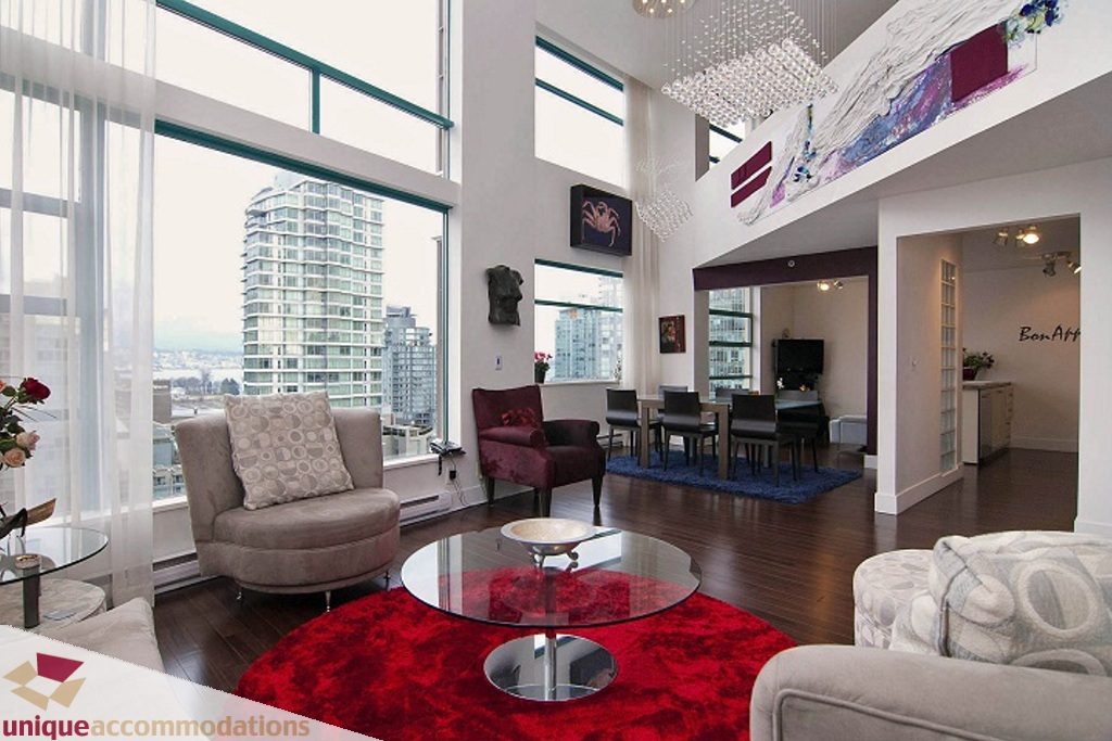 Bright living room with hardwood floors, city view, and modern decor. - PH-1668 Alberni Street, Vancouver Downtown
