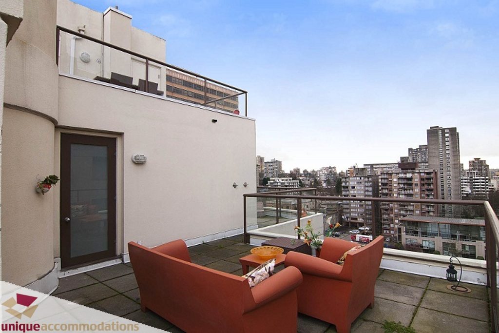 Furnished living room with city view and outdoor seating. - PH-1668 Alberni Street, Vancouver Downtown