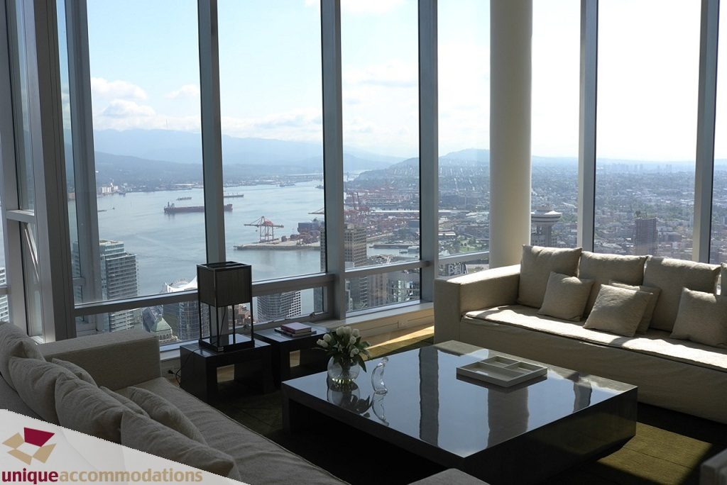 Furnished living room with a stunning city view and modern decor. - 6102-1128 West Georgia, Vancouver Downtown