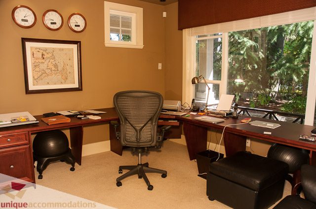 Furnished home office with desk, chair, and large window view. - 3035 Newmarket Drive, North Vancouver