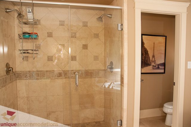Spacious bathroom with large walk-in shower and modern decor. - 3035 Newmarket Drive, North Vancouver