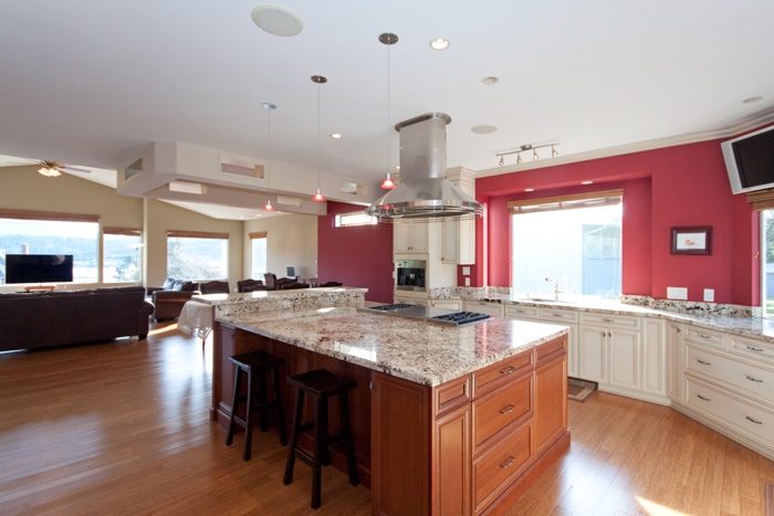 Bright kitchen with granite countertops, hardwood floors, and a city view. - 967 Roslyn Blvd., North Vancouver
