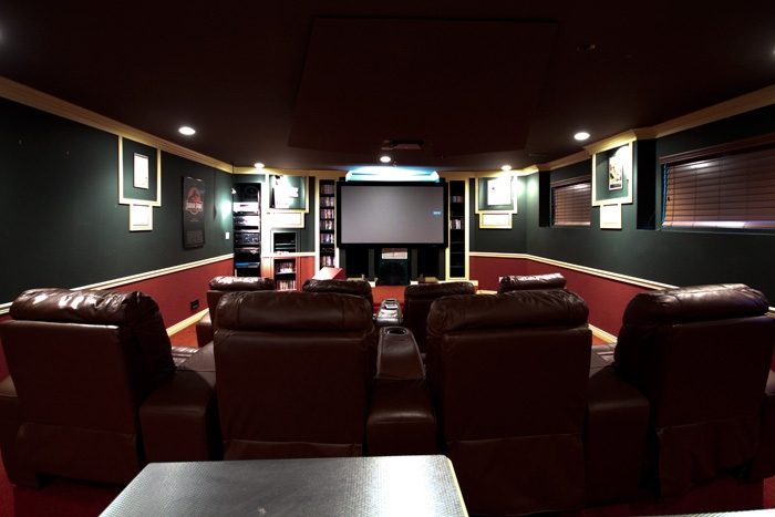 Luxurious home theater with leather recliners and large screen. - 967 Roslyn Blvd., North Vancouver