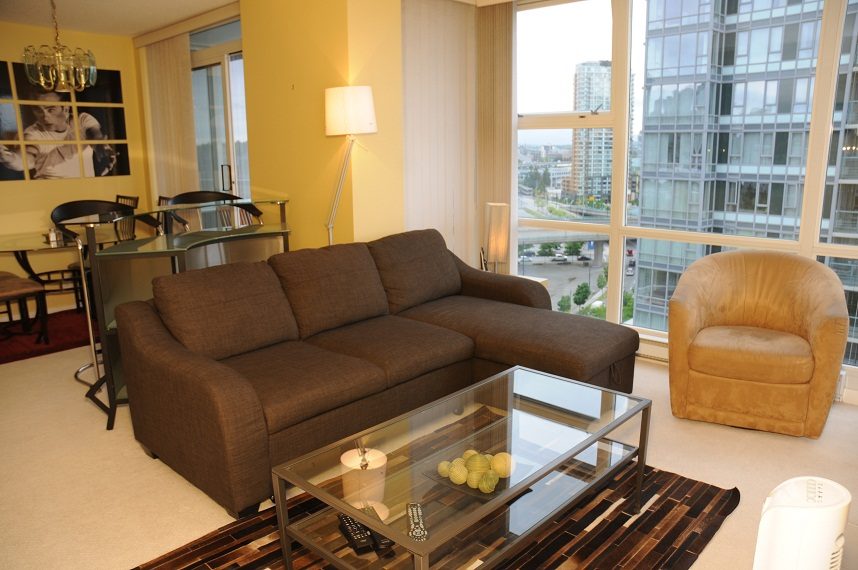 Bright living room with city view and modern furniture. - 1501 -1077 Marinaside Crescent, Vancouver Downtown