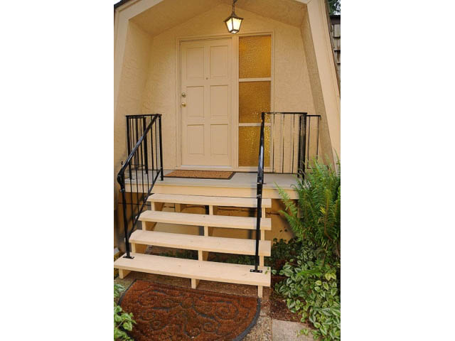 Furnished 1-bedroom cottage with wooden steps and plants. - Cottage - Sinclair Street, West Vancouver