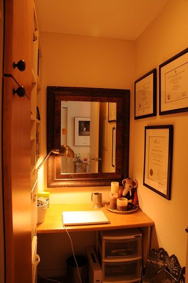 Bright den with wooden desk, framed certificates, and decorative items. - 2605 - 928 Homer Street, Vancouver Downtown