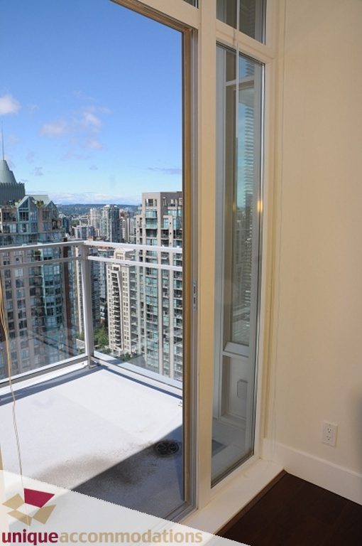 Bright balcony with city view and sliding glass door. - 3401 - 888 Homer Street, Vancouver Downtown
