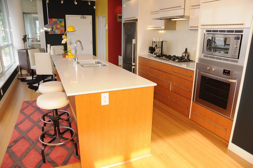 Bright kitchen with white countertops, hardwood floors, and a city view. - 903-718 Main Street, Vancouver Downtown