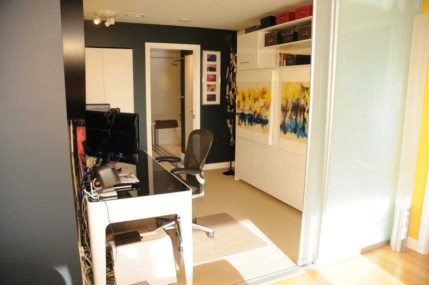 Bright and modern office space with a desk, chair, and artwork on the wall. - 903-718 Main Street, Vancouver Downtown