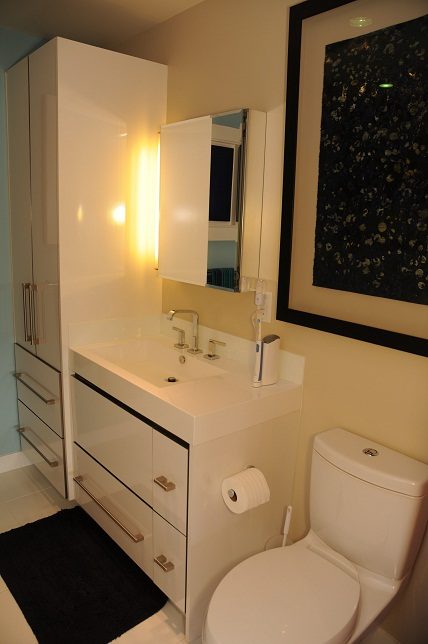 Modern bathroom with sleek white vanity and black accents. - 903-718 Main Street, Vancouver Downtown