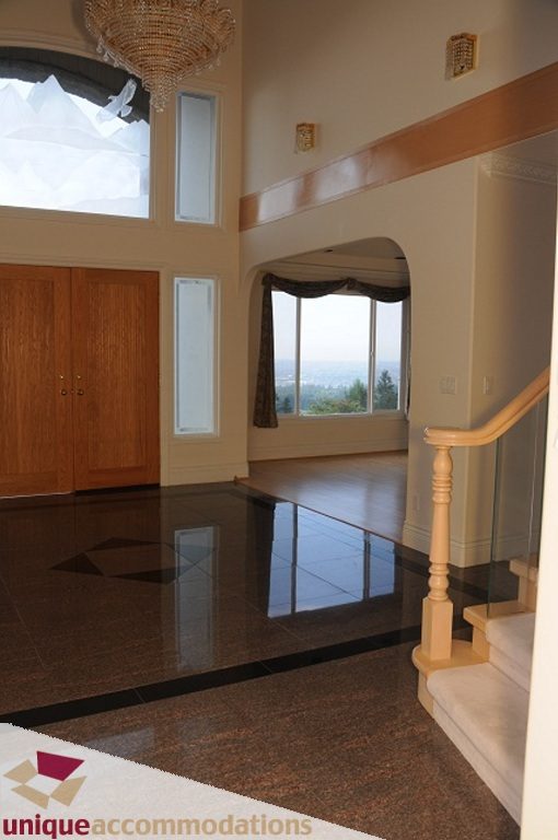 Stunning entryway with marble floors and a grand staircase leading to the second floor. - 4139 Citadel Court, North Vancouver