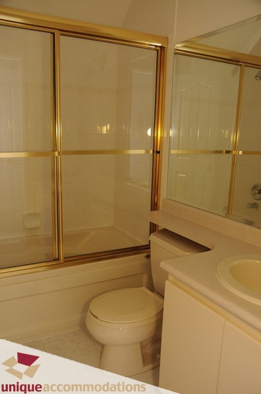 Bathroom with white countertop and gold-framed shower. - 4139 Citadel Court, North Vancouver