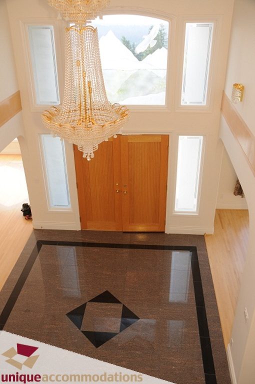 Stunning entryway with crystal chandelier and marble flooring. - 4139 Citadel Court, North Vancouver
