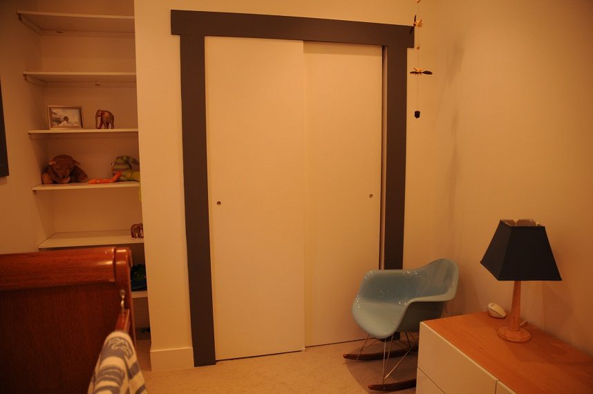 Furnished den with white closet doors, wooden countertop, and modern chair. - 4104 West 12th Avenue, Vancouver West Side