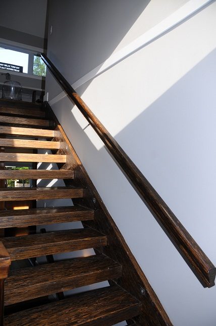 Staircase leading to upper level with wooden steps and handrail. - 4104 West 12th Avenue, Vancouver West Side