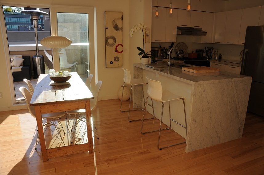 Bright kitchen with marble island, hardwood floors, and a city view. - 411- 2161 West 12th Avenue, Vancouver West Side