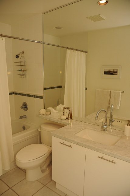 Bright bathroom with white cabinetry and marble countertops. - 411- 2161 West 12th Avenue, Vancouver West Side