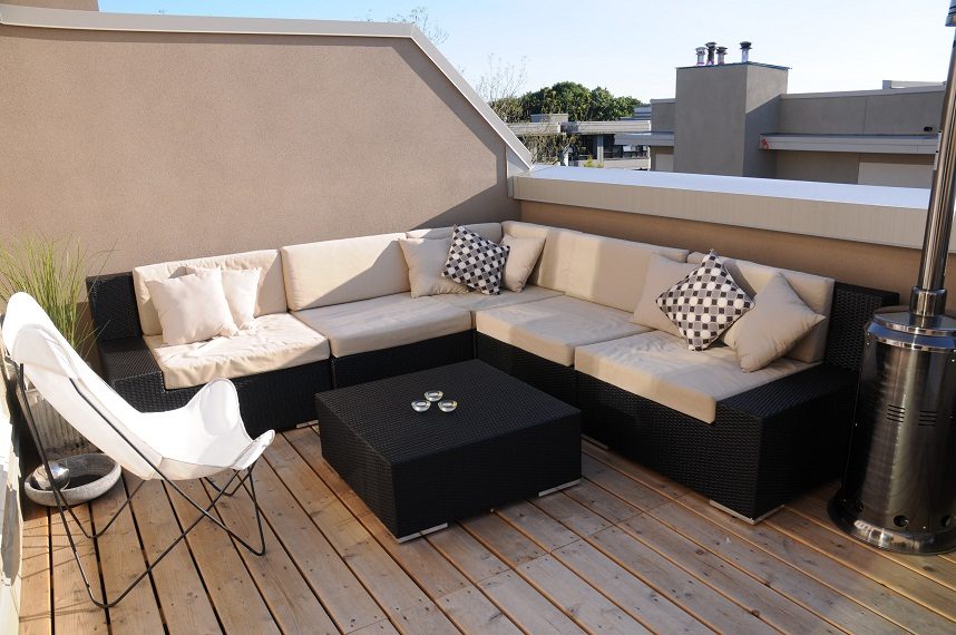 Furnished rooftop patio with a black wicker sectional, white cushions, and a modern coffee table. - 411- 2161 West 12th Avenue, Vancouver West Side