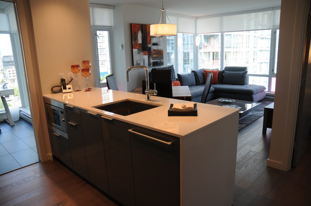 Bright kitchen with white countertops, hardwood floors, and a city view. - 801 - 161 West Georgia, Vancouver Downtown