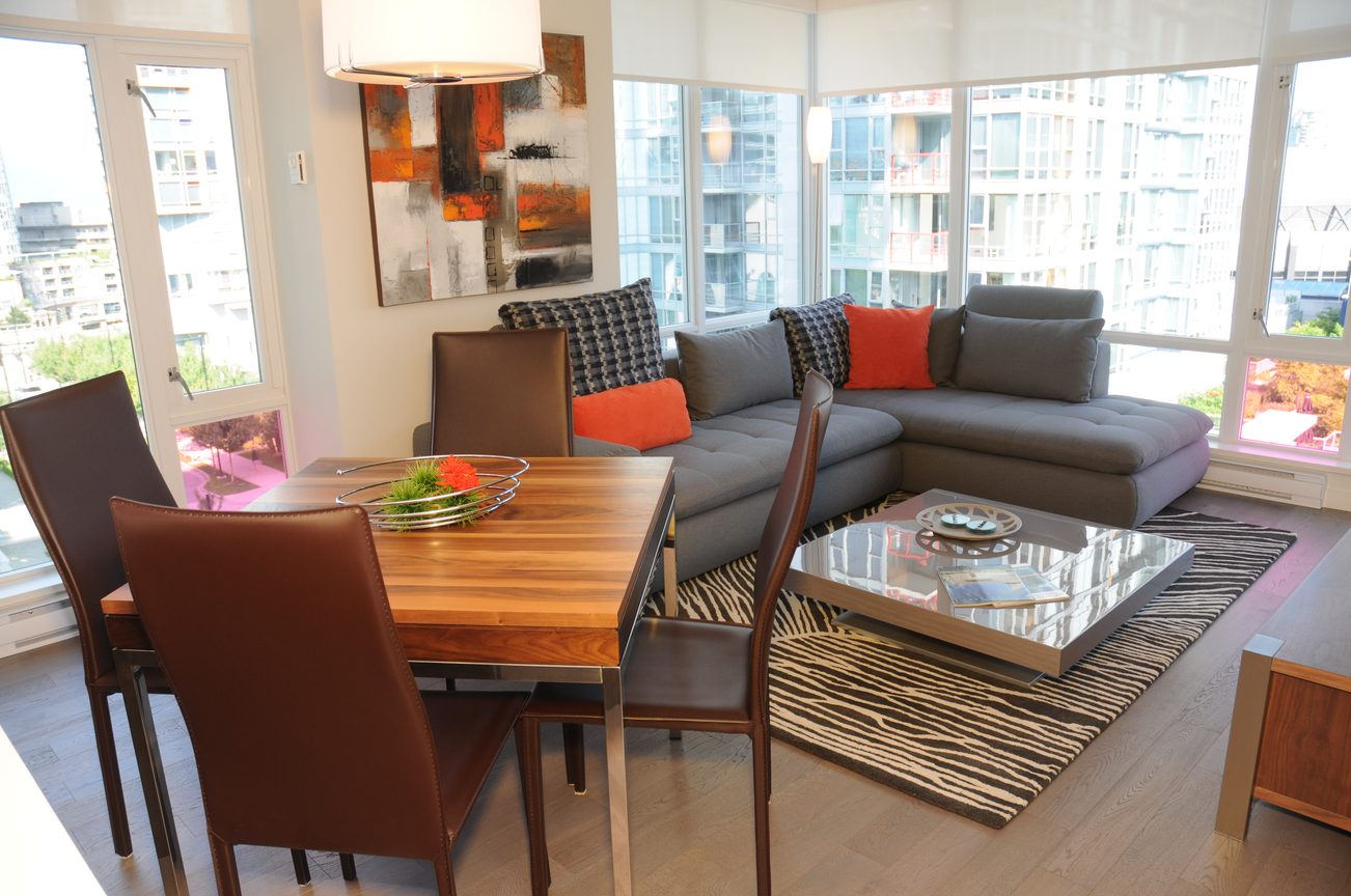 Furnished living room with city view, modern furniture, and hardwood floors. - 801 - 161 West Georgia, Vancouver Downtown