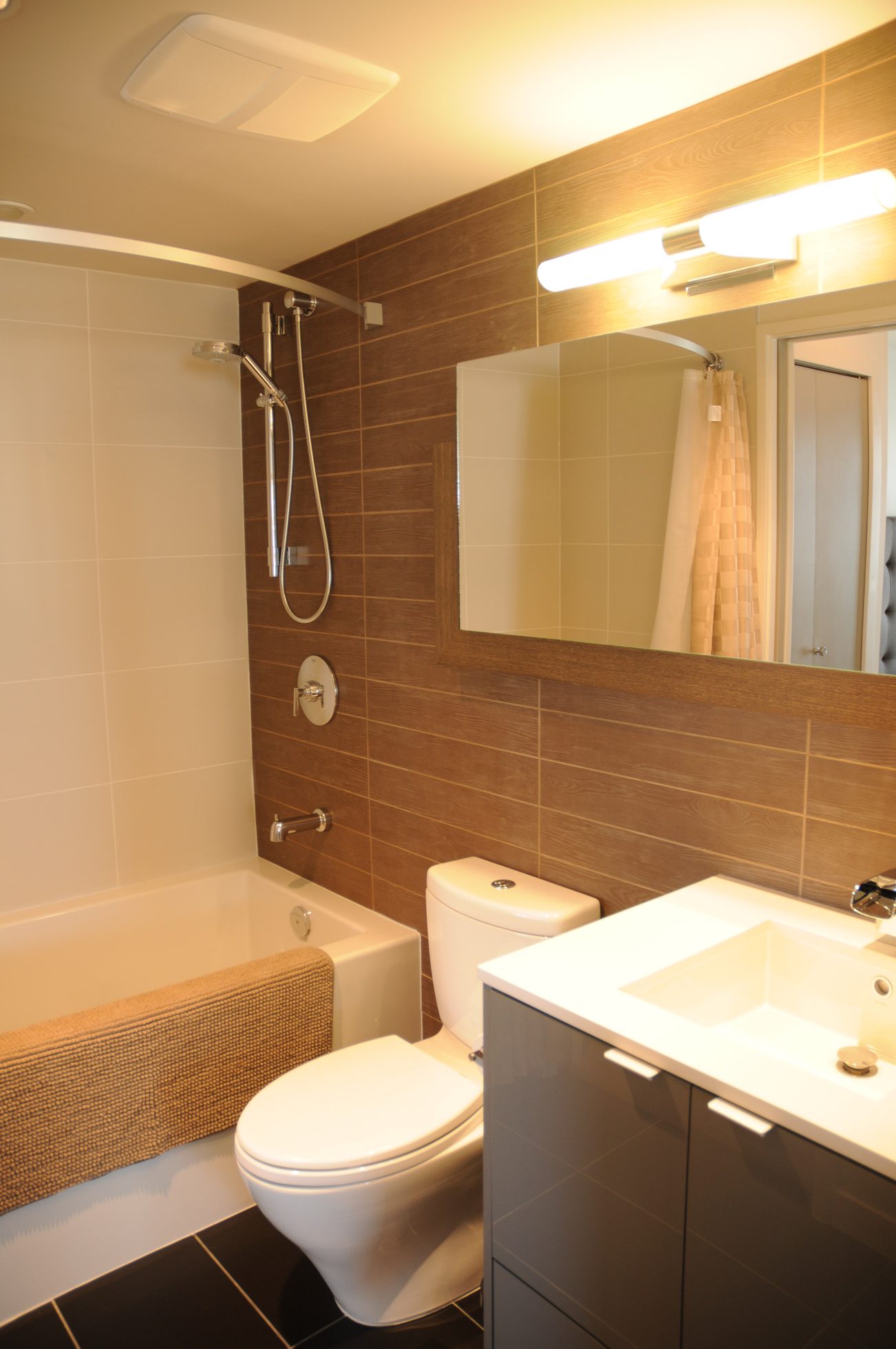 Furnished bathroom with wooden wall paneling and modern fixtures. - 801 - 161 West Georgia, Vancouver Downtown