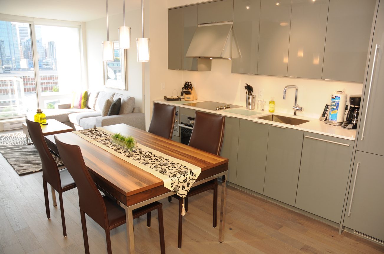 Bright kitchen with modern cabinetry, hardwood floors, and a city view. - 2009 - 161 West Georgia, Vancouver Downtown