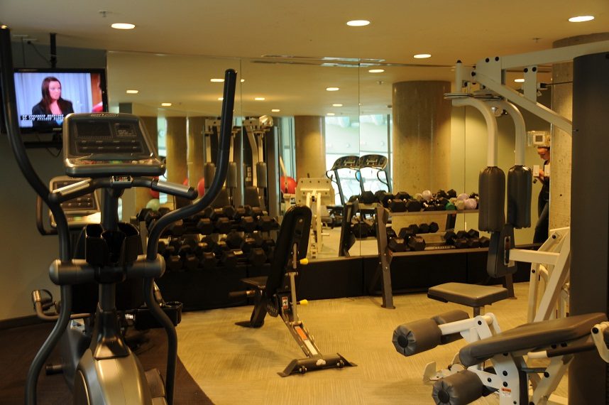 Furnished gym with cardio equipment, mirrors, and dumbbells. - 506 - 618 Abbott Street, Vancouver Downtown