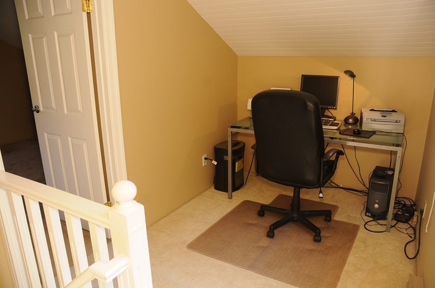 Small home office with a desk, chair, and printer. - 5591 Huckleberry Place, North Vancouver