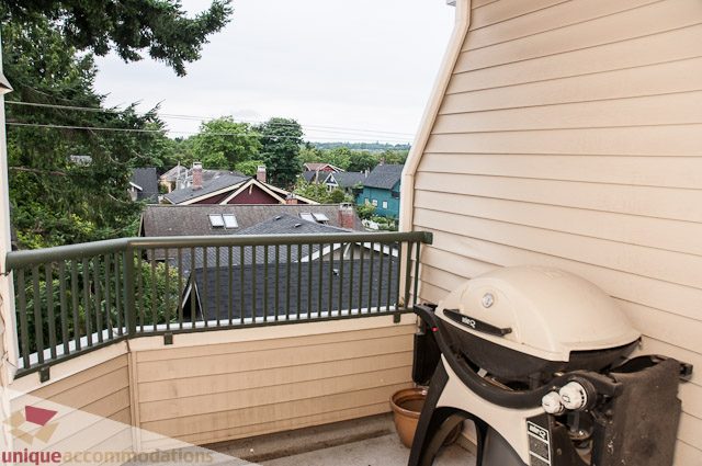 Furnished balcony with city view and outdoor furniture. - 402- 2680 West 4th Ave PH2, Vancouver West Side