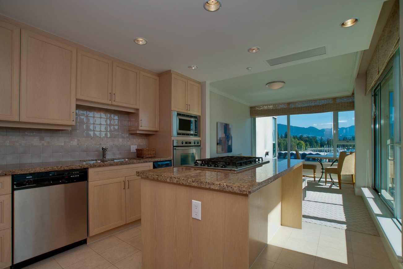 Bright kitchen with granite countertops, stainless steel appliances, and a city view. - 603 - 1717 Bayshore Drive, Vancouver Downtown