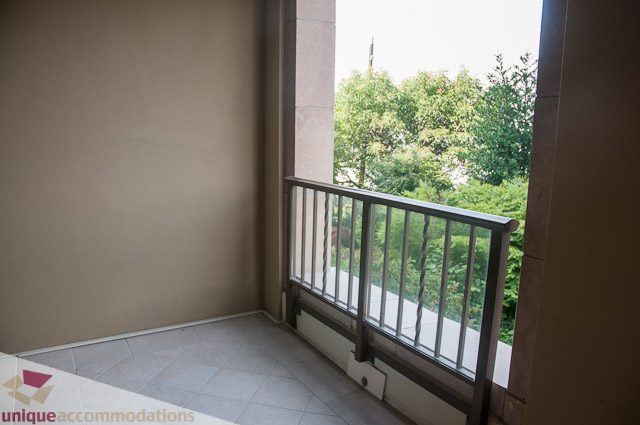 Balcony with view of trees and greenery. - 103-2288 Bellevue Ave, West Vancouver