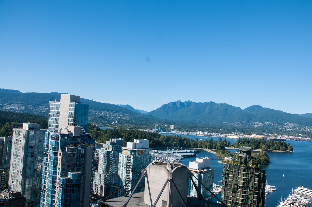Bright living room with stunning city view and marina, featuring modern furnishings and large windows. - 3201 - 1331 Alberni, Vancouver Downtown