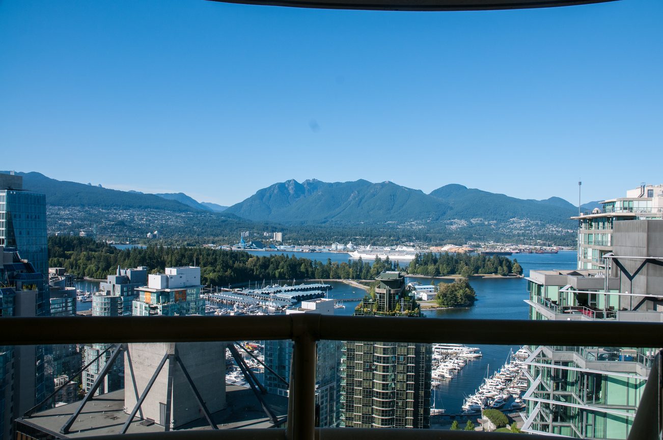 Bright balcony with stunning city and mountain view, surrounded by modern buildings and marina. - 3201 - 1331 Alberni, Vancouver Downtown