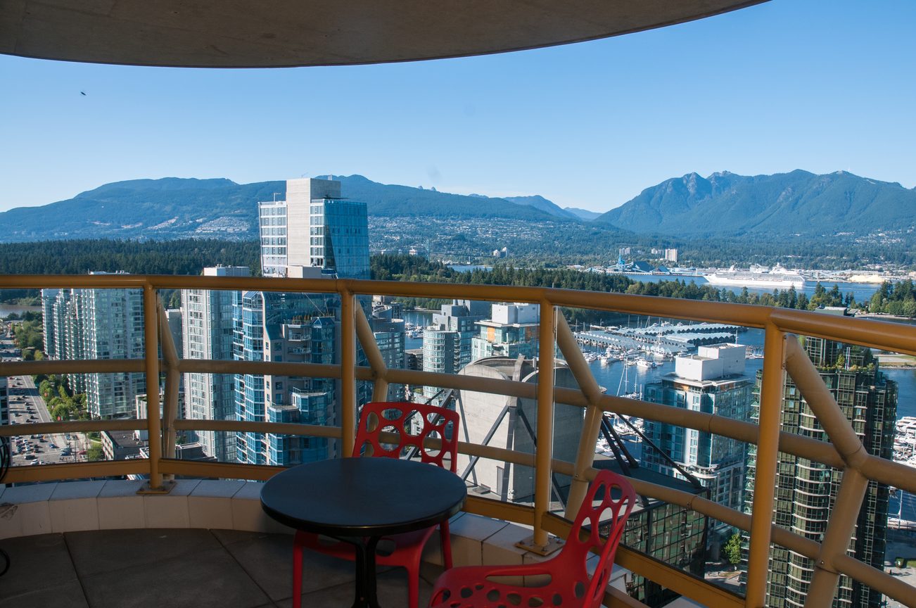 Balcony with city view, modern furnishings, and mountain backdrop. - 3201 - 1331 Alberni, Vancouver Downtown