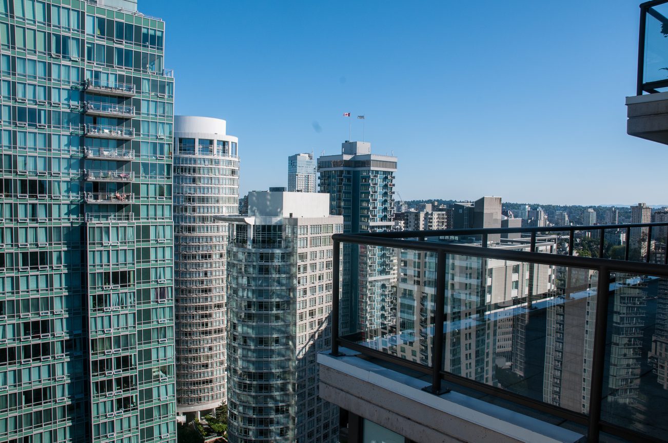 Bright balcony with city view, modern furnishings, and sleek glass railings. - 3201 - 1331 Alberni, Vancouver Downtown