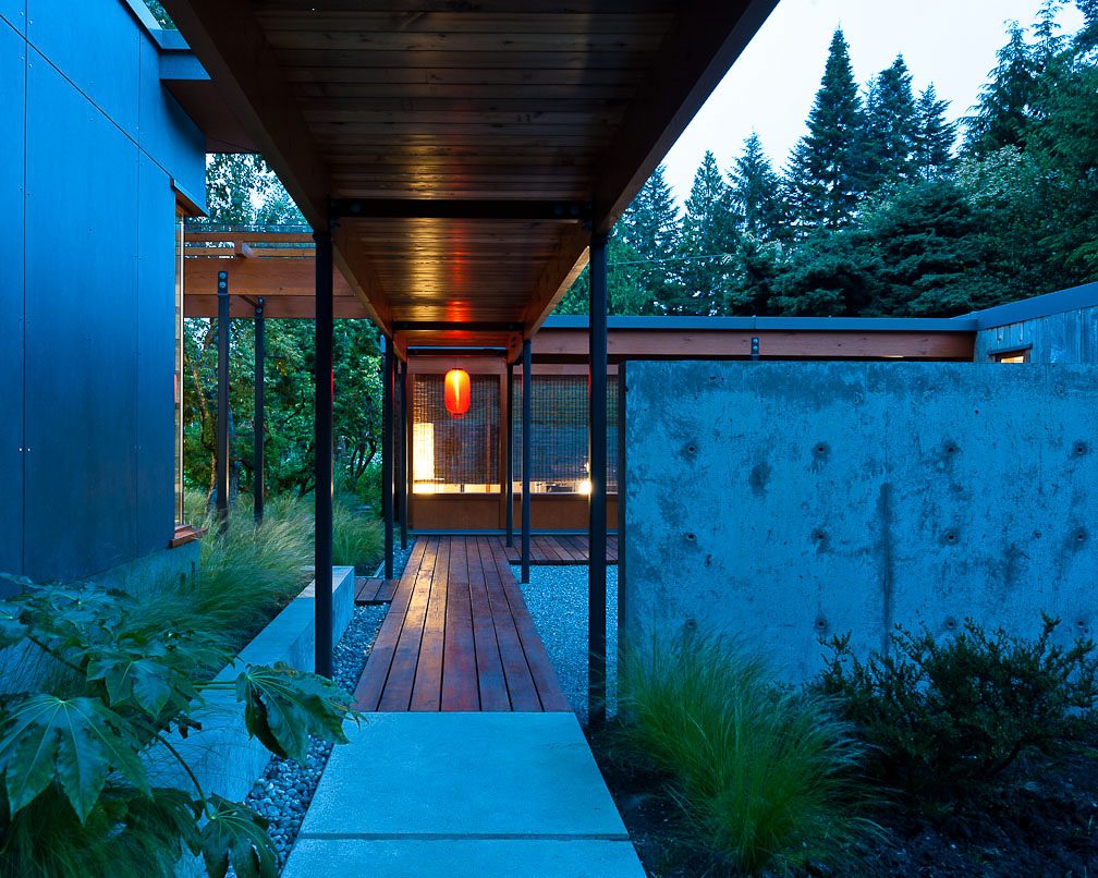 Furnished 1-bedroom house with wooden deck and modern concrete walls. - 430 Stevens Dr, West Vancouver