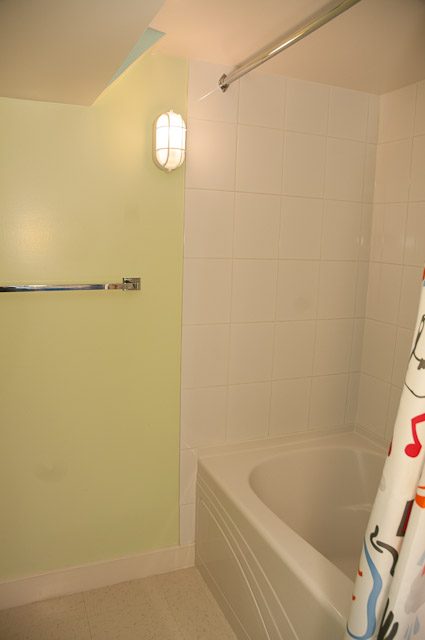 Bathroom with white tile shower and light green wall. - 2885 West 34th Avenue, Vancouver West Side