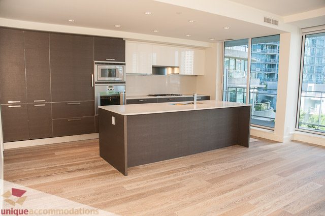 Bright kitchen with modern island, hardwood floors, and city view. - 302 - 1409 W Pender, Vancouver Downtown