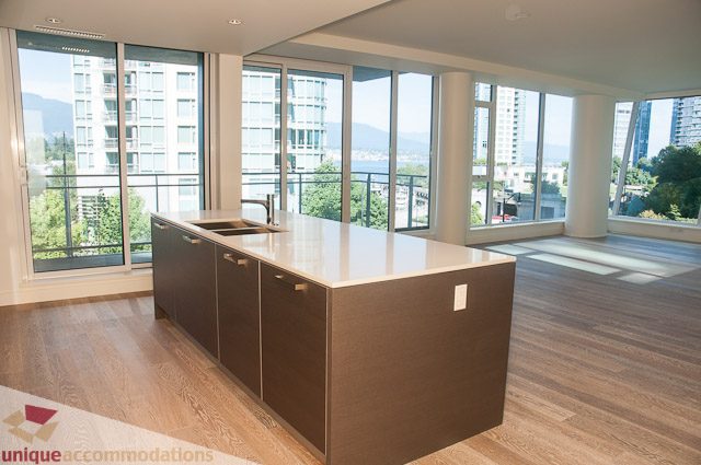 Bright kitchen with large island, hardwood floors, and a stunning city view. - 302 - 1409 W Pender, Vancouver Downtown