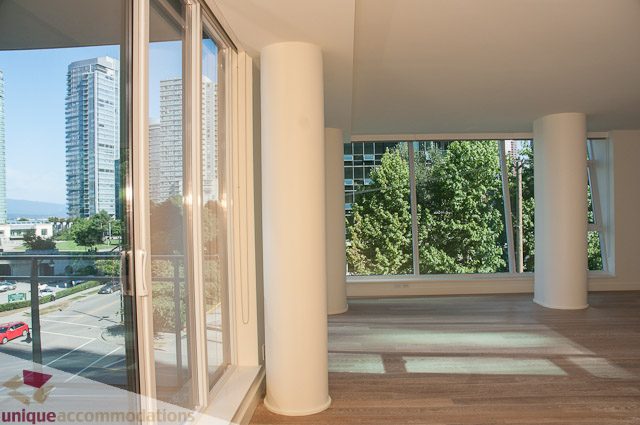 Spacious living room with hardwood floors and a city view. - 302 - 1409 W Pender, Vancouver Downtown