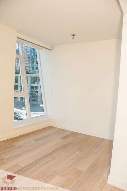 Bright living room with hardwood floors and city view. - 302 - 1409 W Pender, Vancouver Downtown