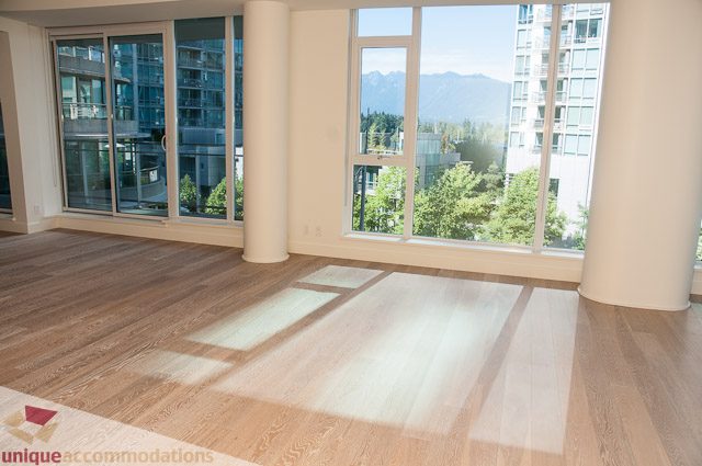 Bright living room with hardwood floors and city view. - 302 - 1409 W Pender, Vancouver Downtown