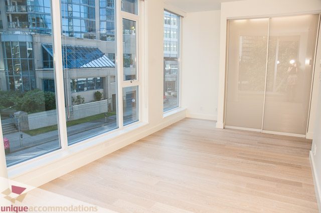 Bright living room with hardwood floors and city view. - 302 - 1409 W Pender, Vancouver Downtown