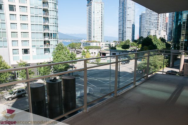 Furnished balcony with city view and modern furnishings. - 302 - 1409 W Pender, Vancouver Downtown