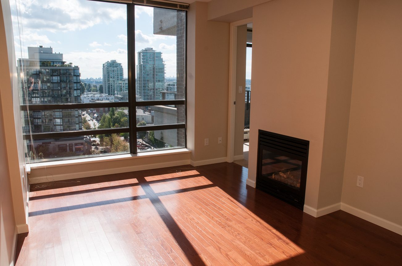 Bright living room with hardwood floors and city view. - 1102 -170 W 1st Street, North Vancouver